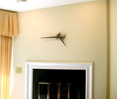 June 2003 clock over a fireplace
