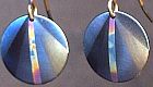 Click for details about Titanium Domed disks with rainbow. 